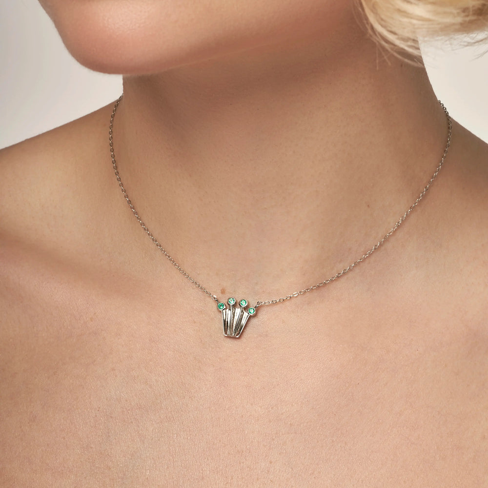 Silver chain necklace with a crown form pendant with green onyx gemstones