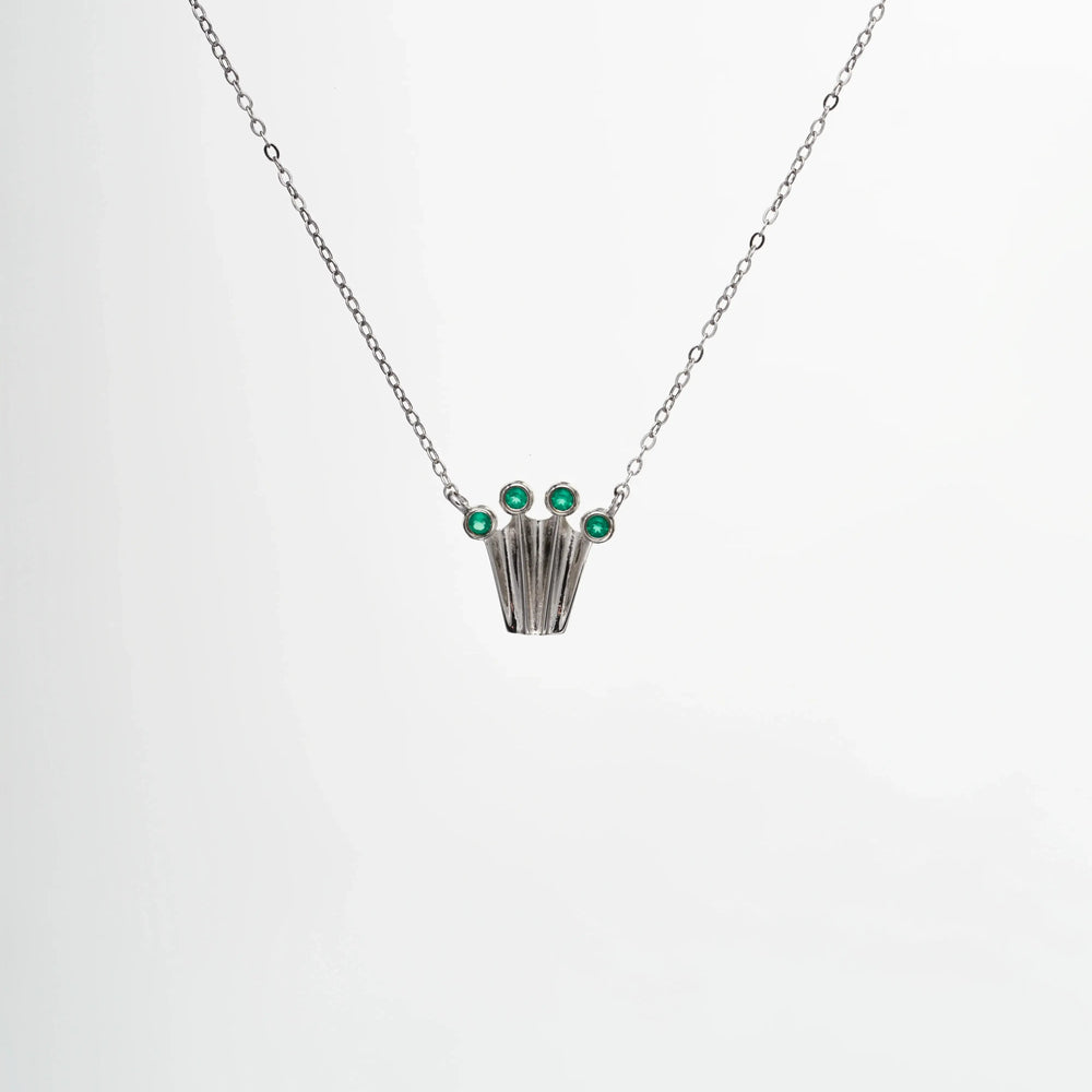
                  
                    Silver chain necklace with a crown form pendant with green onyx gemstones
                  
                