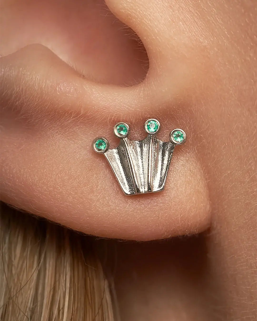 Silver stud earrings in crown form with green onyx gemstones