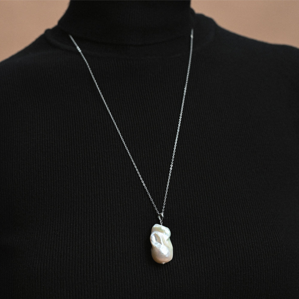 Silver pendant with chain and white baroque pearl