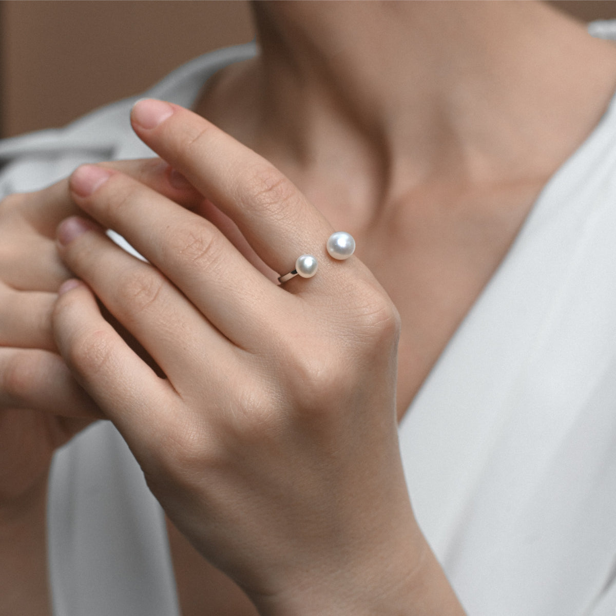 Silver ring with two white pearls 