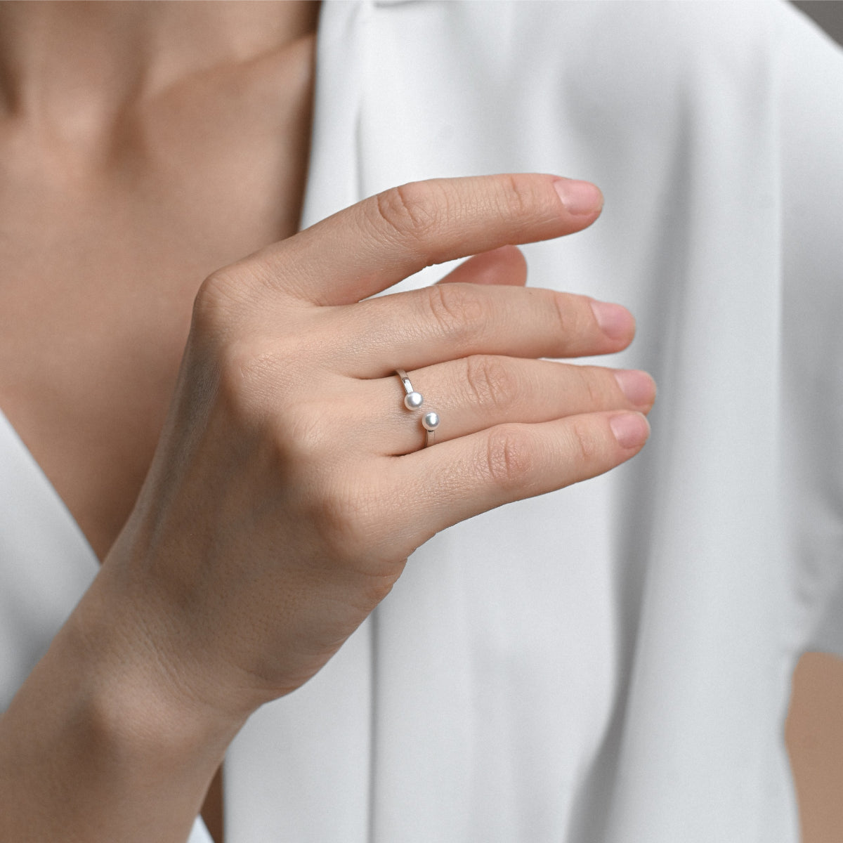 Silver open waves ring with two white pearls of 7mm