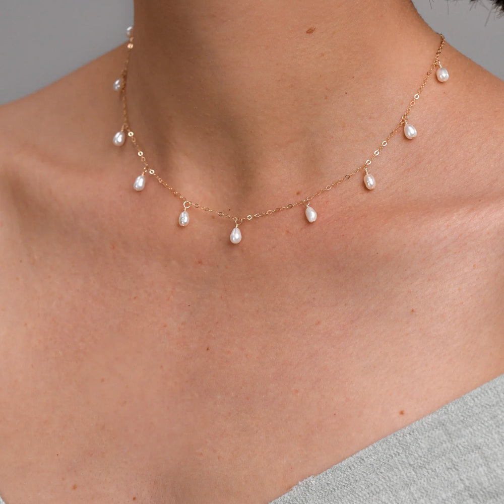 Necklace white pearls in gold-filled sun