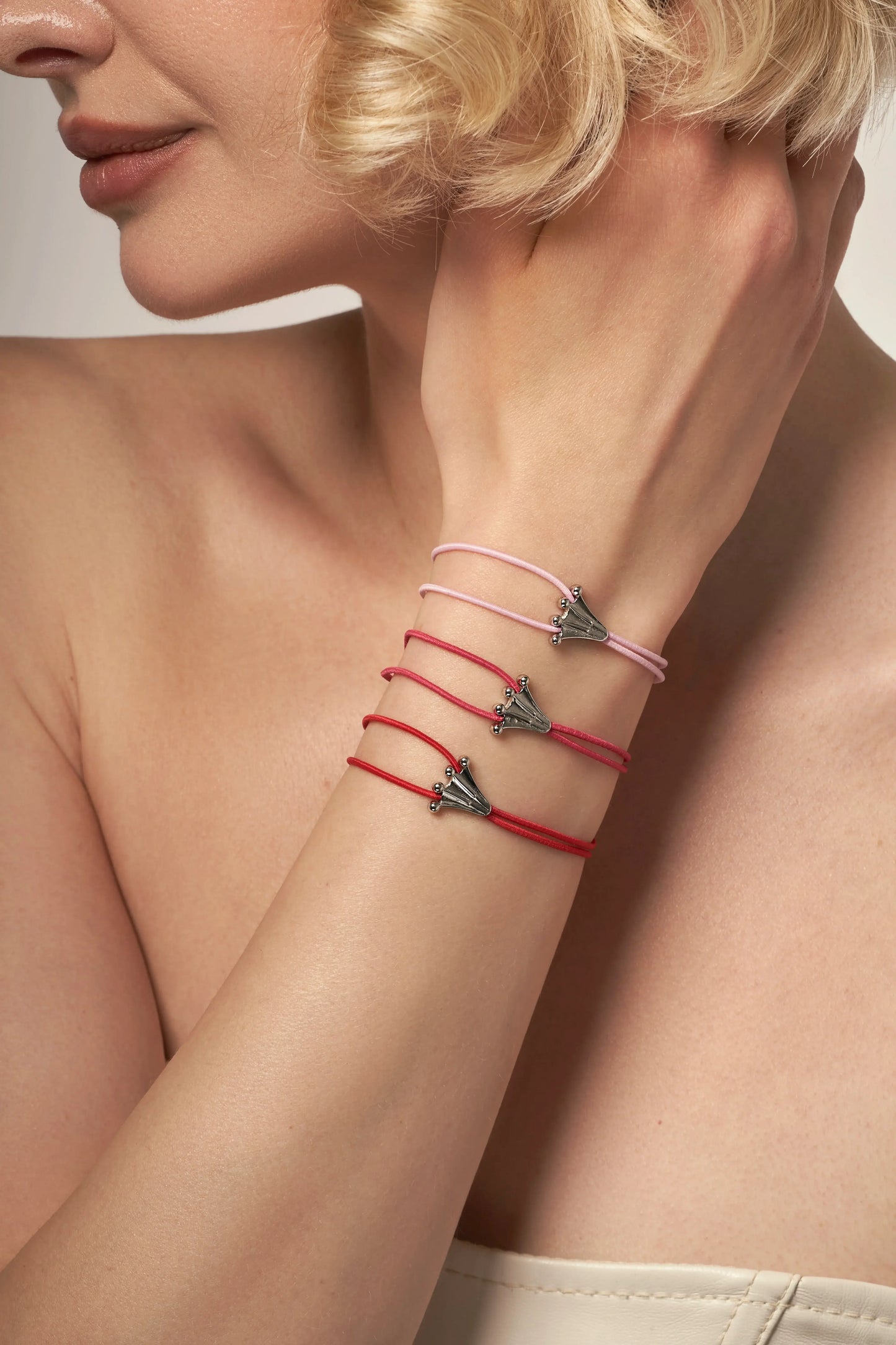 Frog's paw charms on elastic bracelets