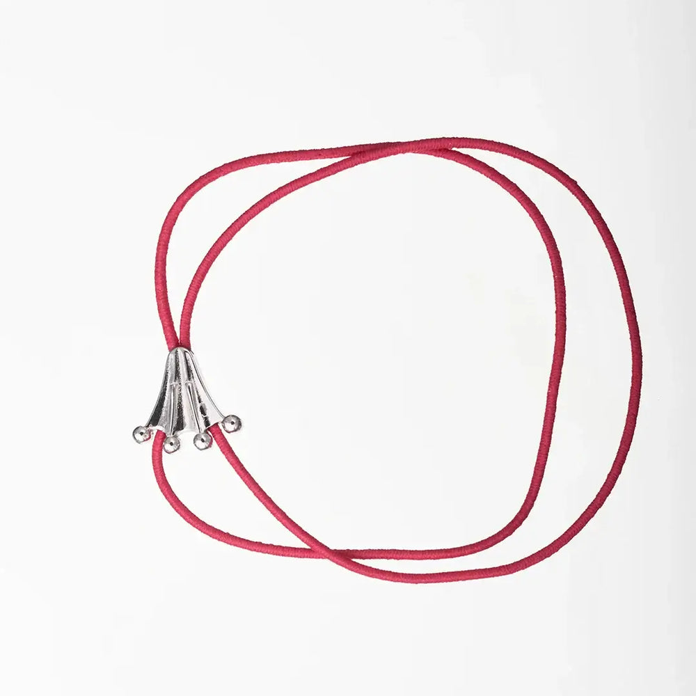 Frog's paw logo on fuchsia elastic bracelet