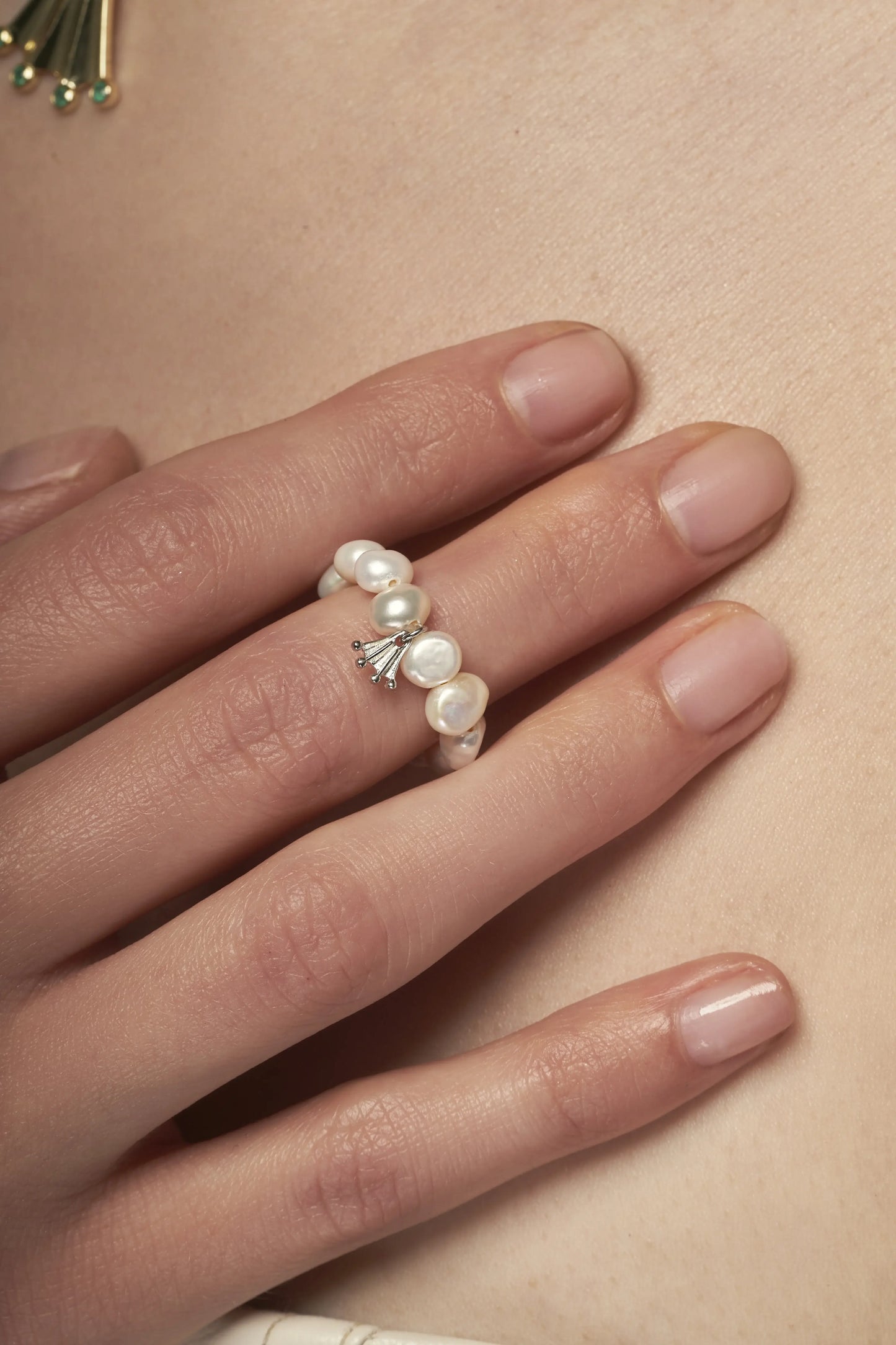 White baroque pearl ring with a silver Frog paw-shaped pendant
