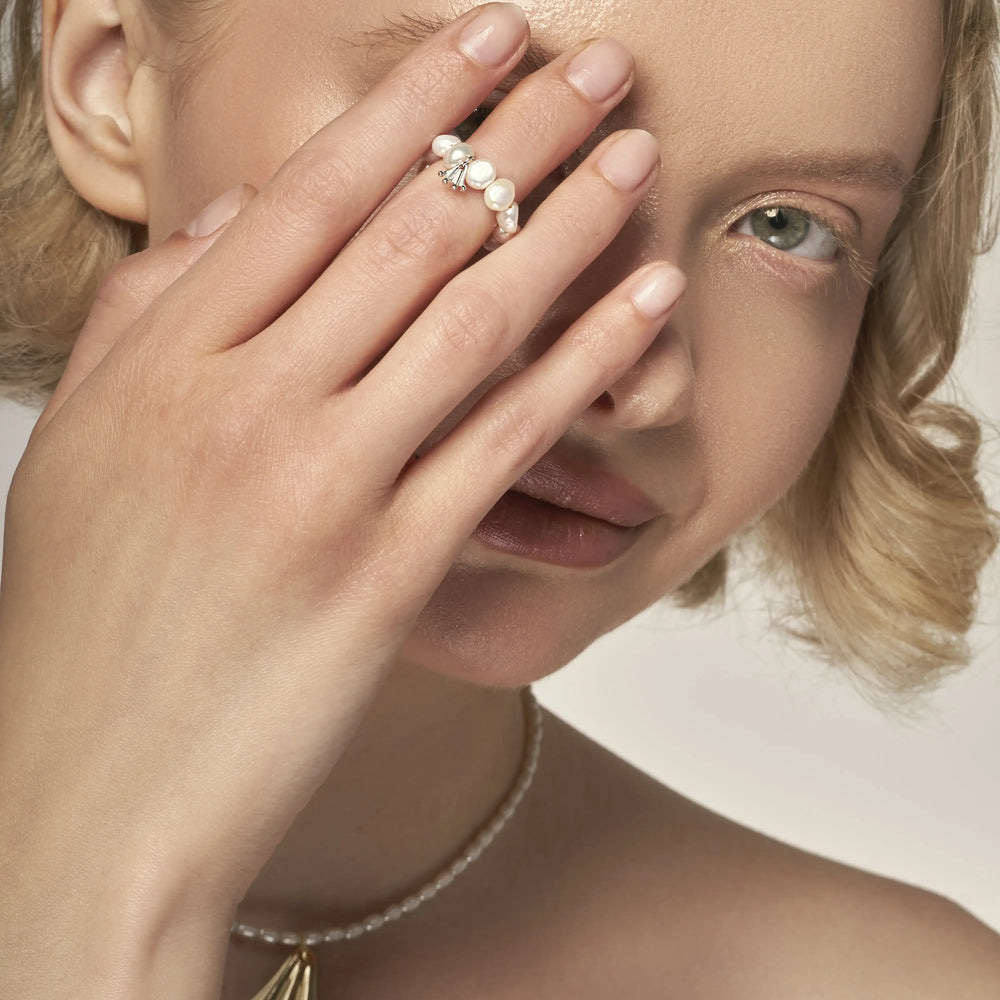 Baroque white pearl ring with a silver Frog paw-shaped pendant
