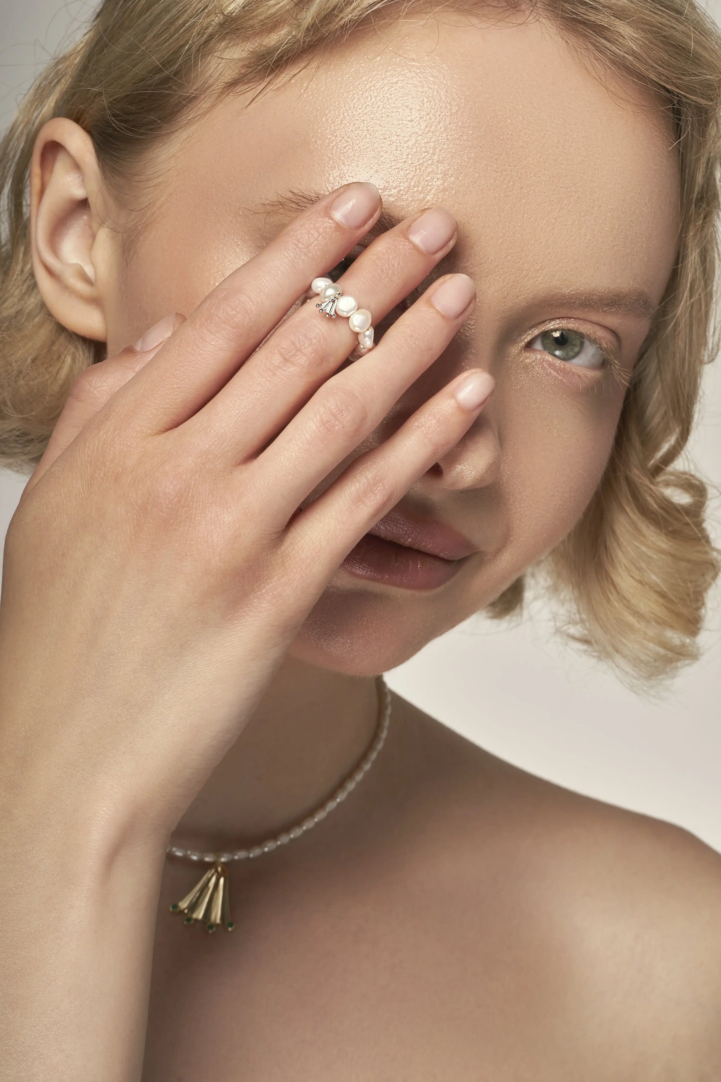Baroque white pearl ring with a silver Frog paw-shaped pendant
