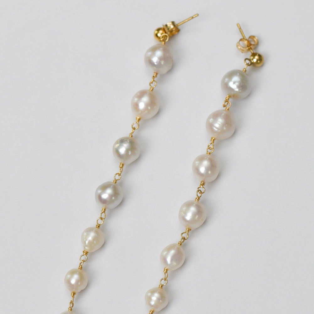 
                      
                        Premium Round White Pearl Earrings with Gold Chain
                      
                    