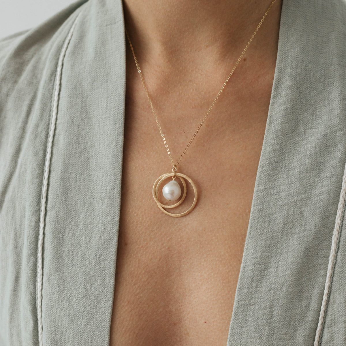 necklace Universe with white baroque pearl and two circles, gold-filled chain