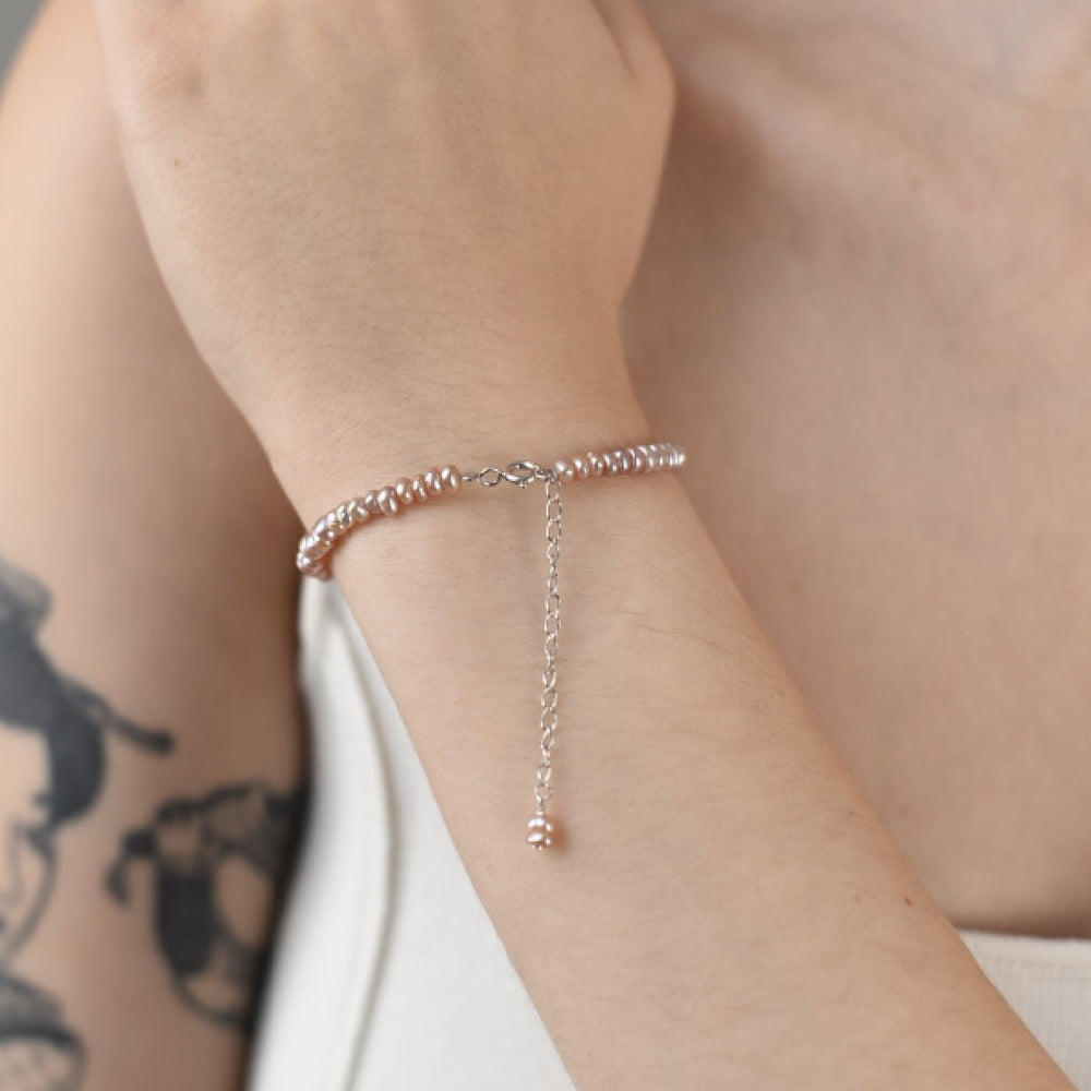 
                  
                    Bracelet with 4mm natural round pink pearls, silver chain
                  
                